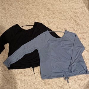 Calvin Klein Performance shirts with front pouch, drawstring waist, open back.